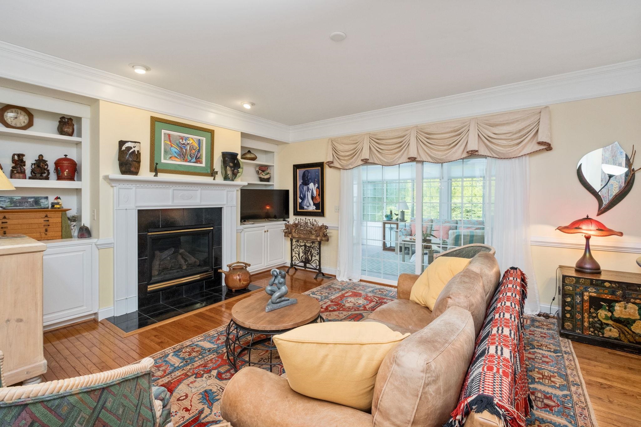 35 Buckingham Common Waynesboro, VA 22980 - Photo 4 of 33 a living room with furniture a large window and a fireplace