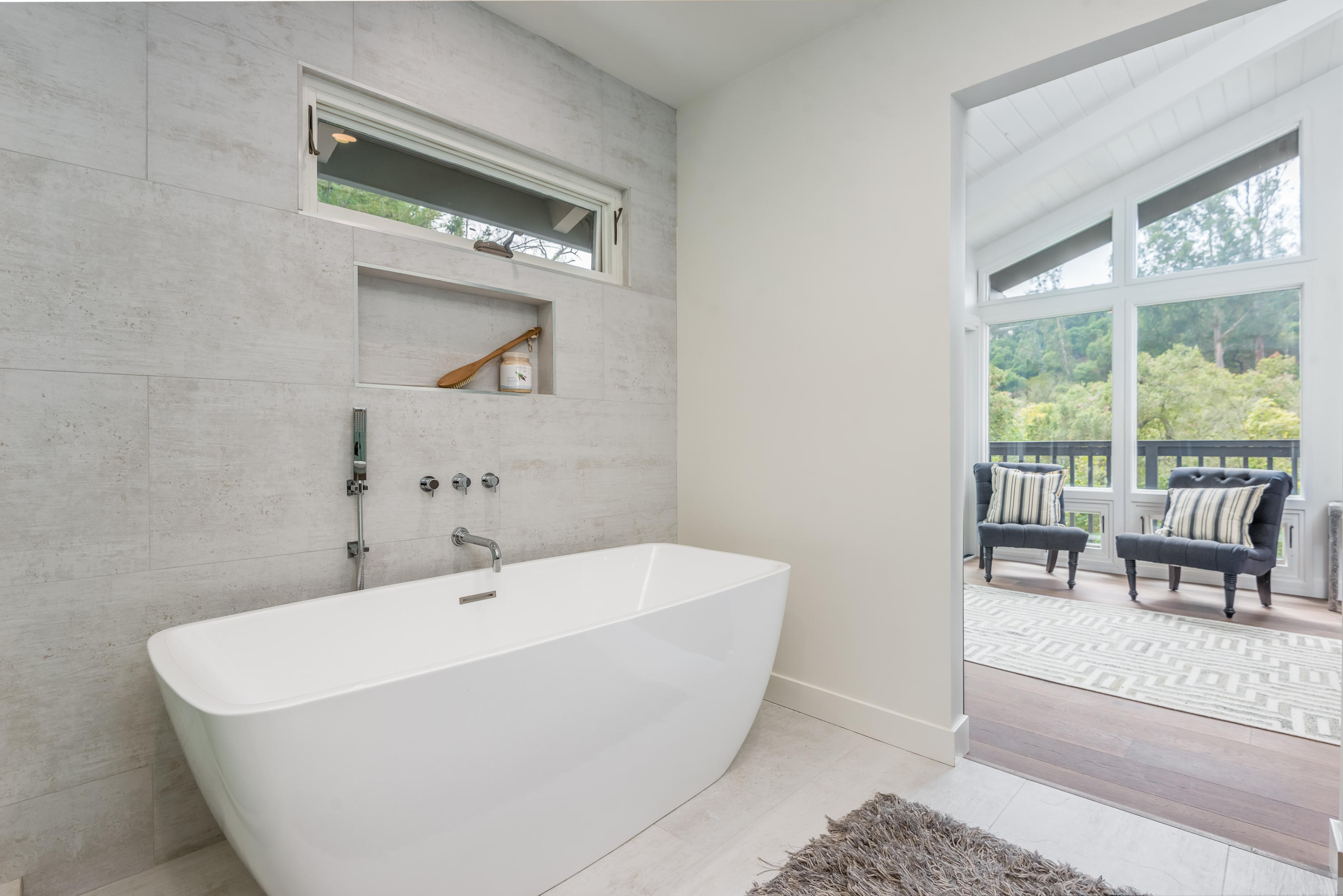 925 El Rancho Road Santa Barbara, CA 93108 - Photo 11 of 20 a white bath tub sitting in a bathroom next to a window