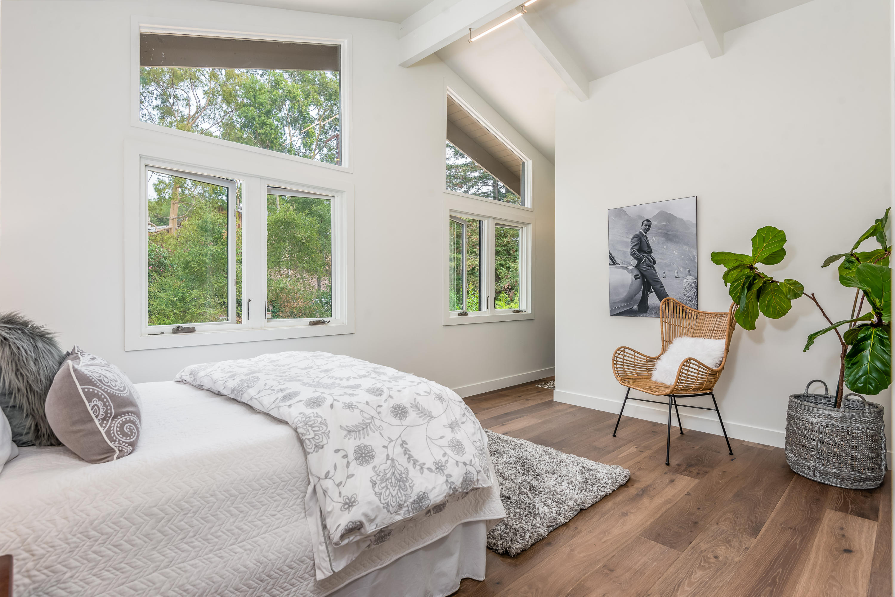 925 El Rancho Road Santa Barbara, CA 93108 - Photo 12 of 20 a bedroom with a bed and wooden floor