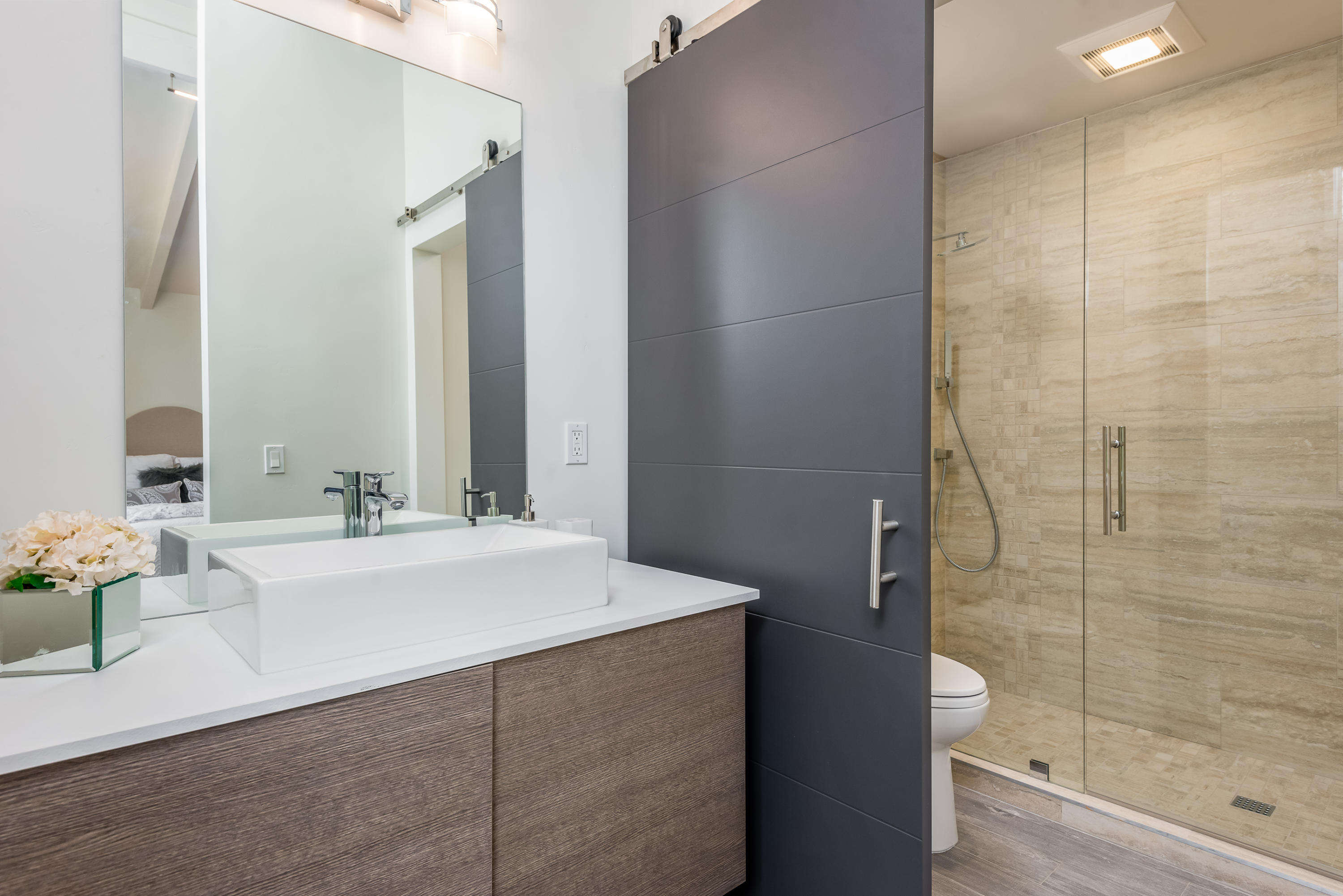 925 El Rancho Road Santa Barbara, CA 93108 - Photo 13 of 20 a bathroom with a bathtub sink vanity and mirror