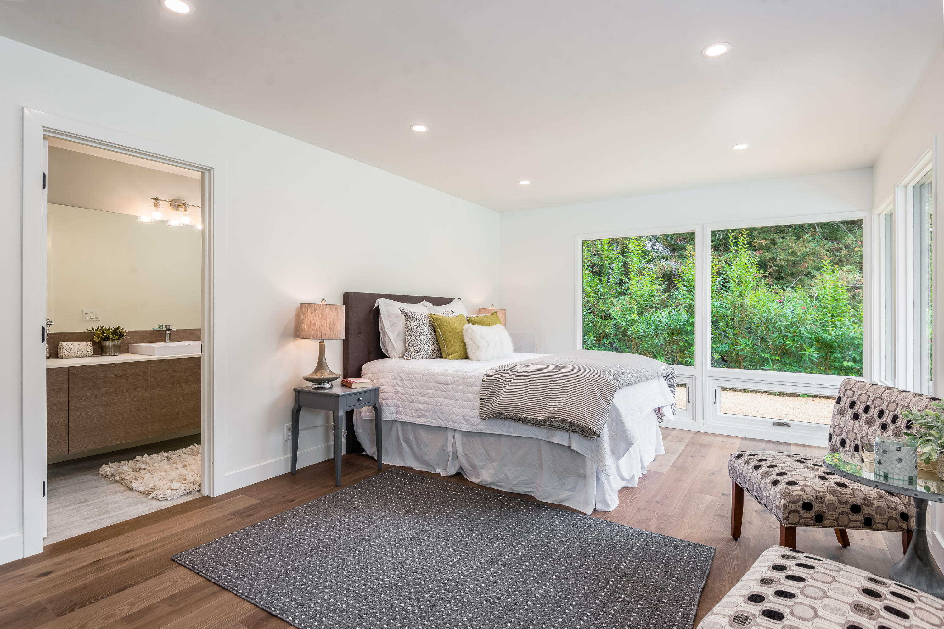 925 El Rancho Road Santa Barbara, CA 93108 - Photo 16 of 20 a bedroom with a bed and wooden floor