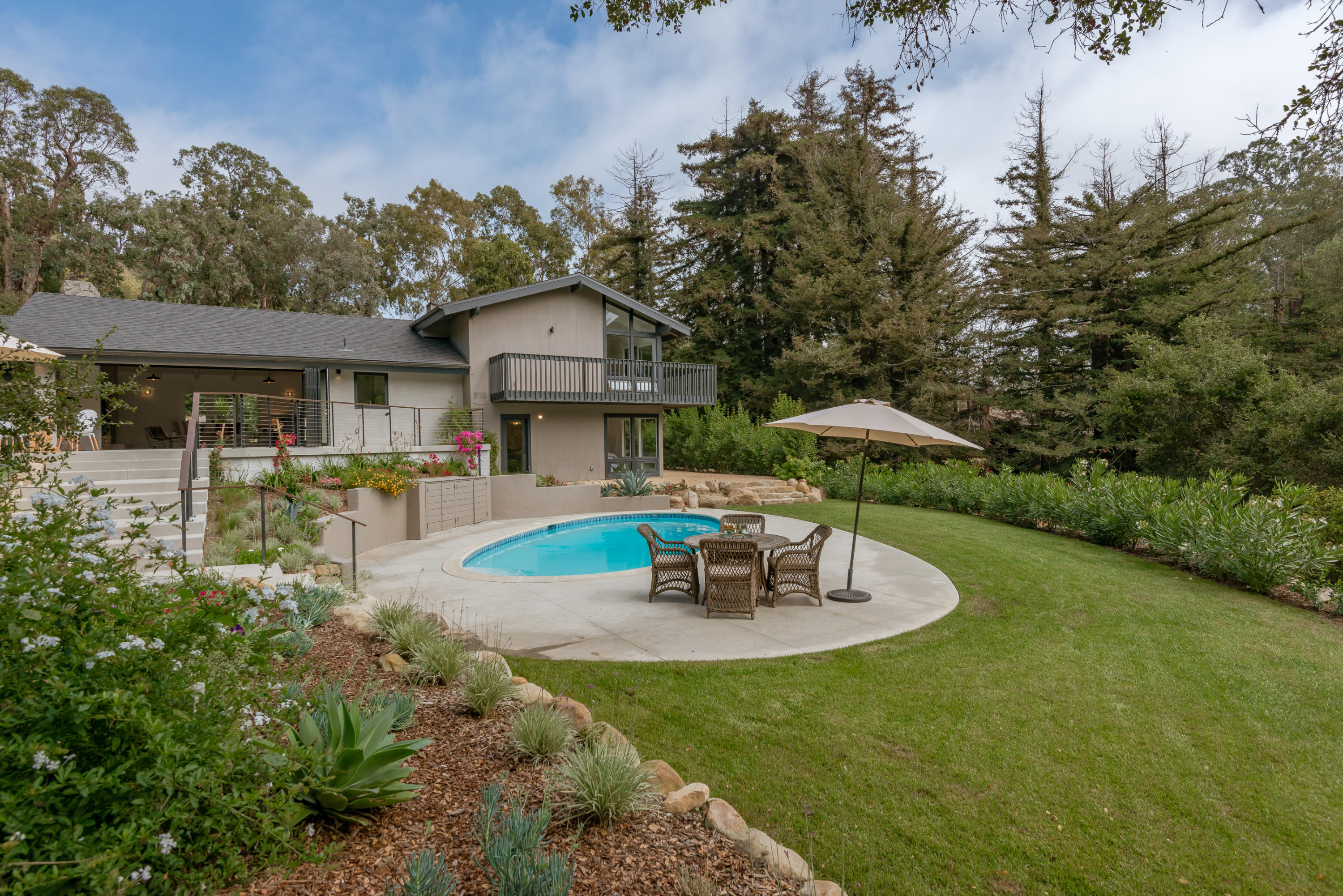 925 El Rancho Road Santa Barbara, CA 93108 - Photo 19 of 20 a view of a house with swimming pool and sitting area