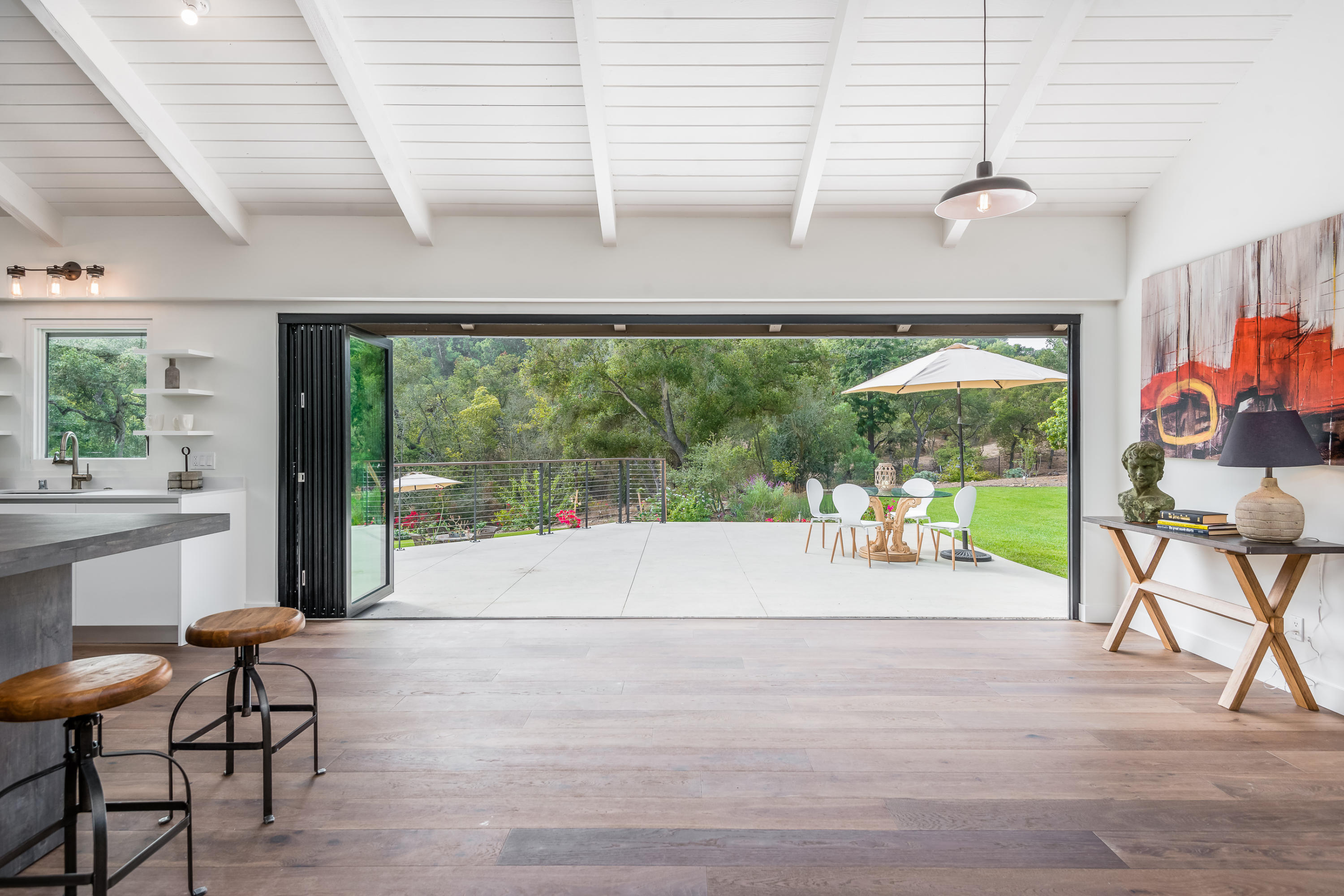 925 El Rancho Road Santa Barbara, CA 93108 - Photo 2 of 20 a view of a room with wooden floor and outdoor space