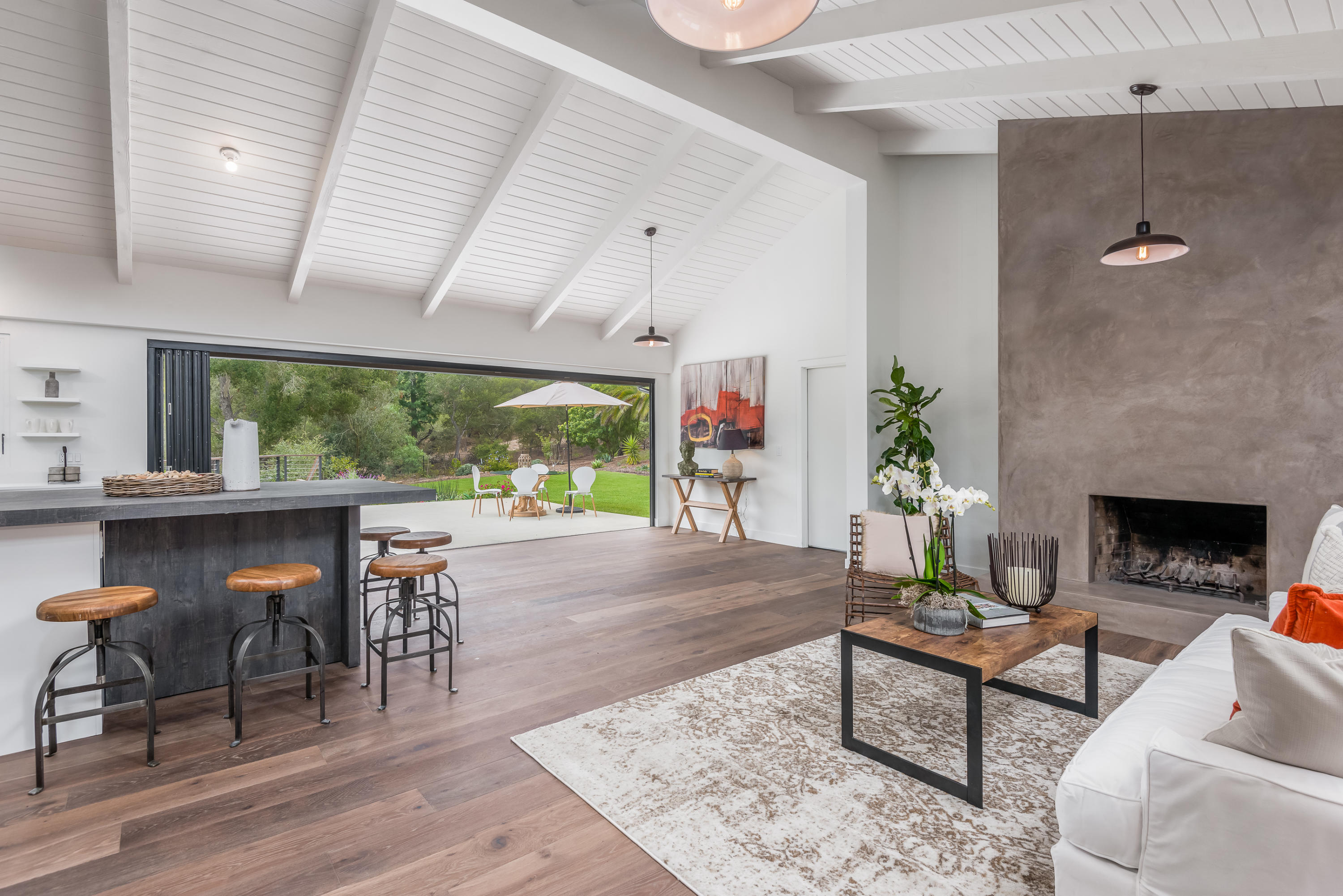 925 El Rancho Road Santa Barbara, CA 93108 - Photo 3 of 20 a living room with furniture a fireplace and a table