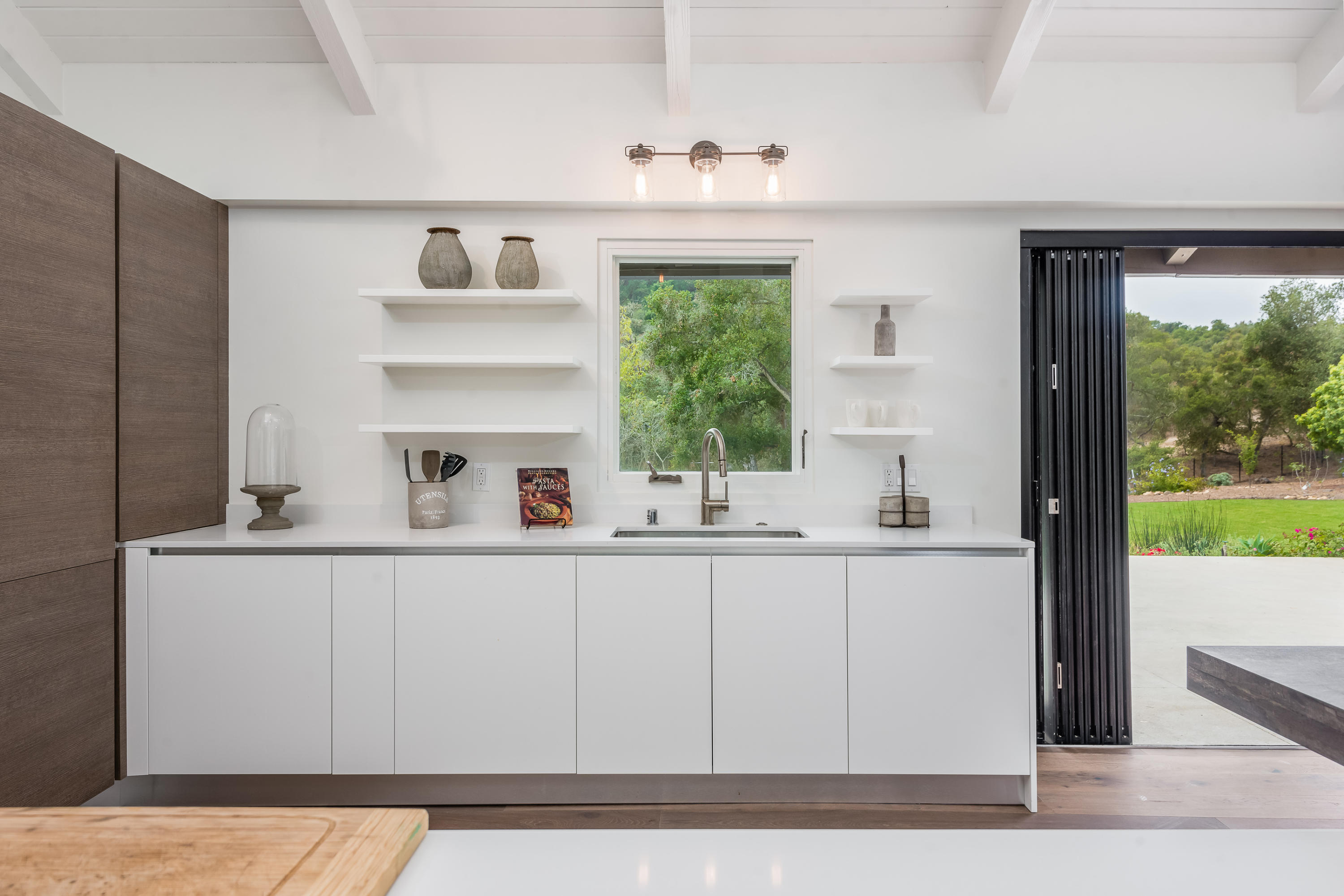 925 El Rancho Road Santa Barbara, CA 93108 - Photo 6 of 20 a kitchen with a sink and cabinets