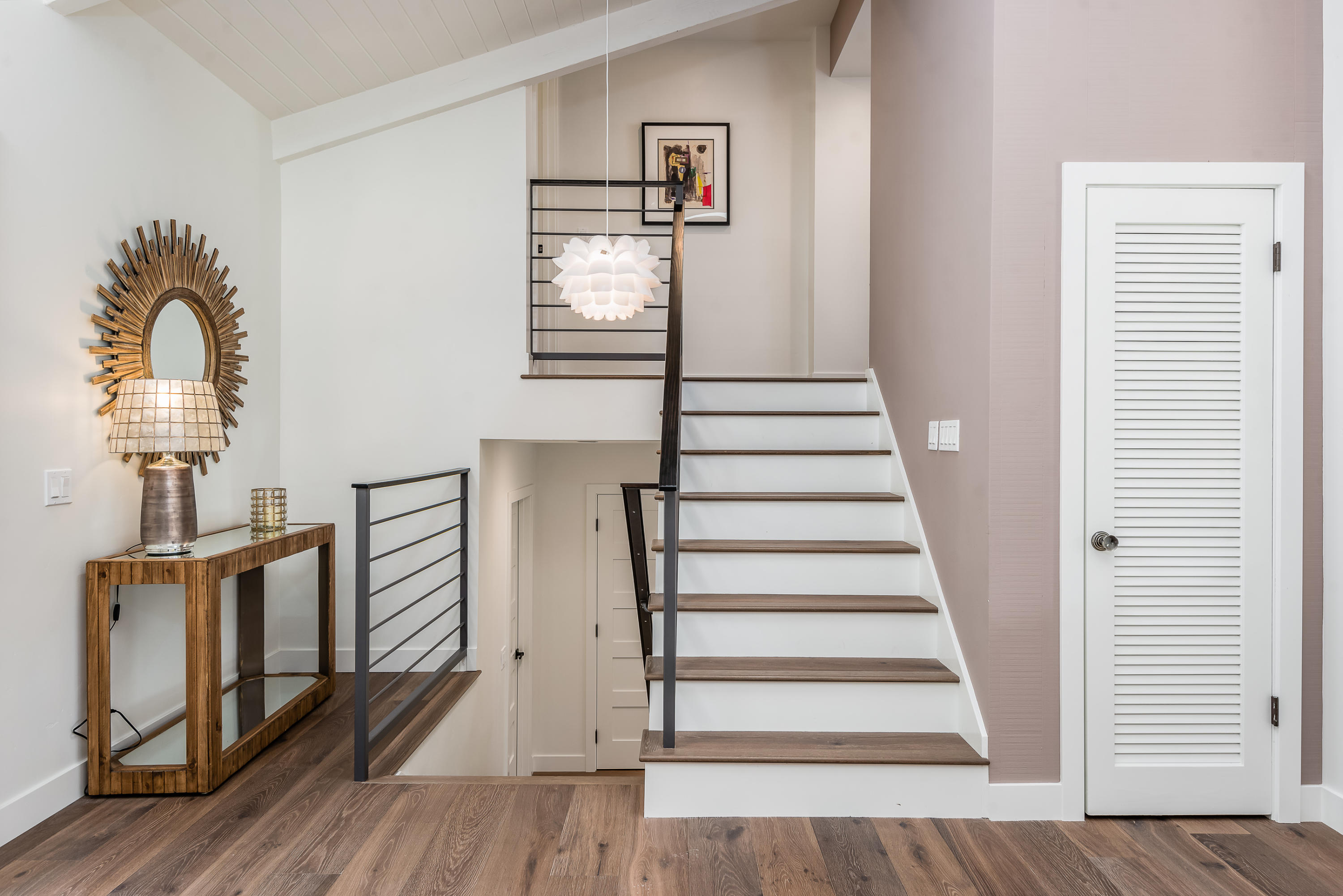 925 El Rancho Road Santa Barbara, CA 93108 - Photo 7 of 20 a view of a livingroom with wooden floor and stairs