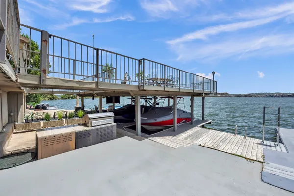 a view of a swimming pool with furniture