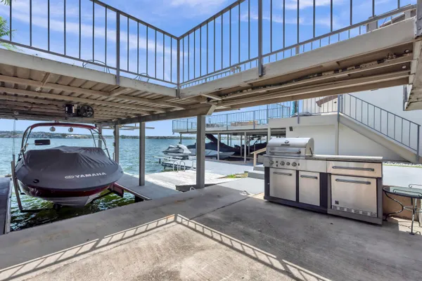 a view of a kitchen with a sink and cabinets