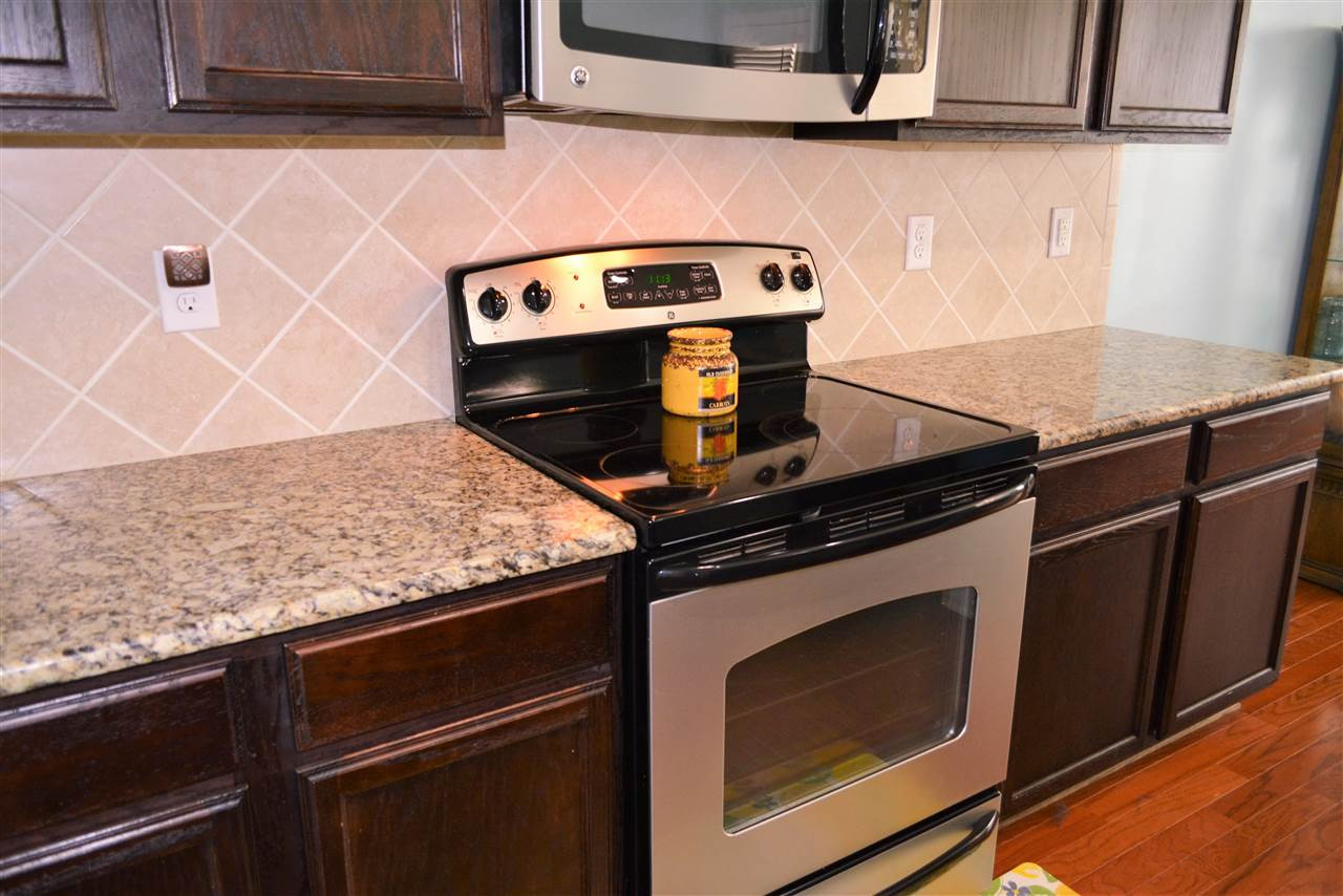 2003 Chancellor Place Raleigh, NC 27603 - Photo 9 of 30 Gorgeous granite & tile backsplash