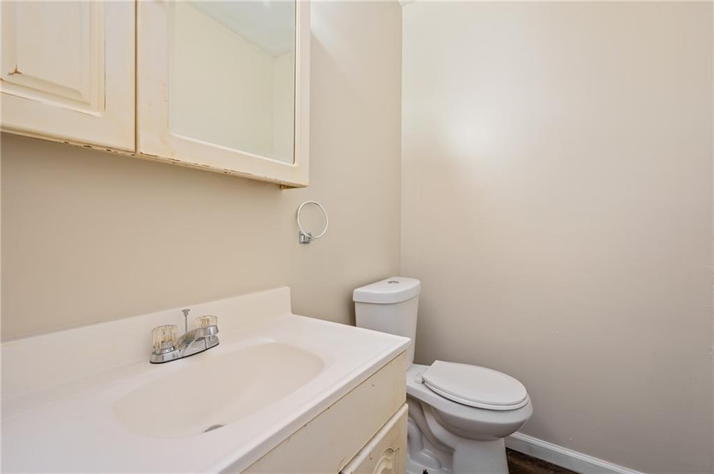 912 2nd Street McKees Rocks, PA 15136 - Photo 12 of 24 a bathroom with a sink a toilet and vanity