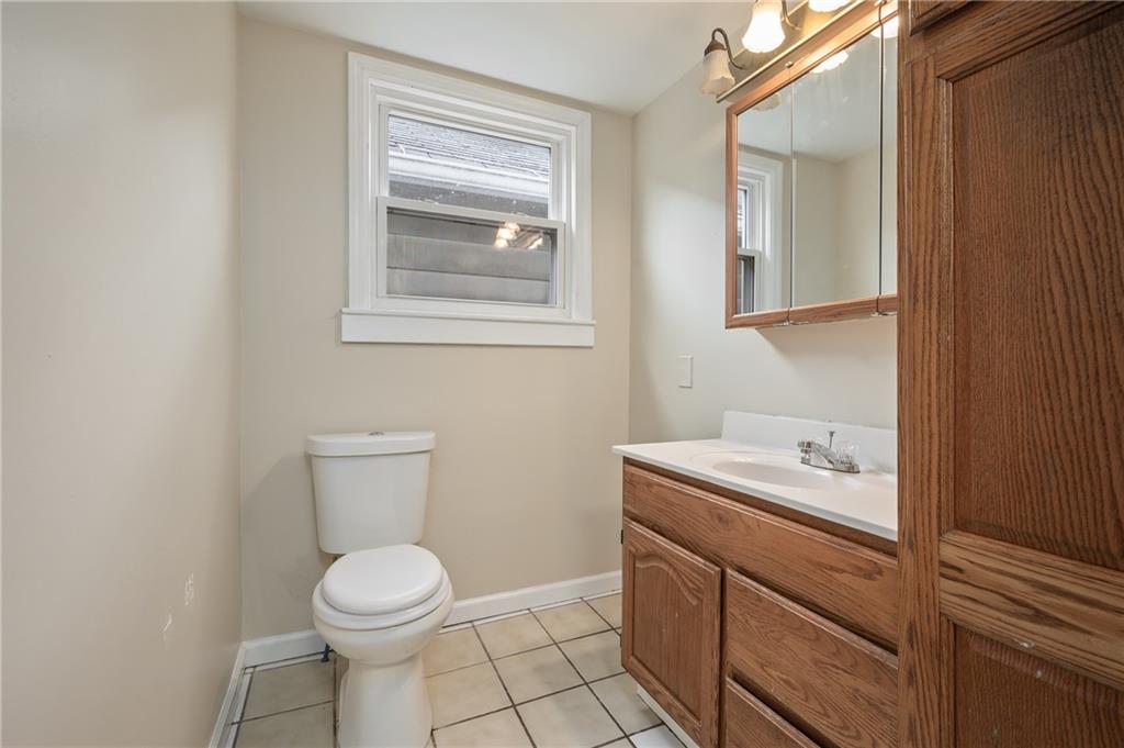 912 2nd Street McKees Rocks, PA 15136 - Photo 18 of 24 a bathroom with a toilet sink and mirror