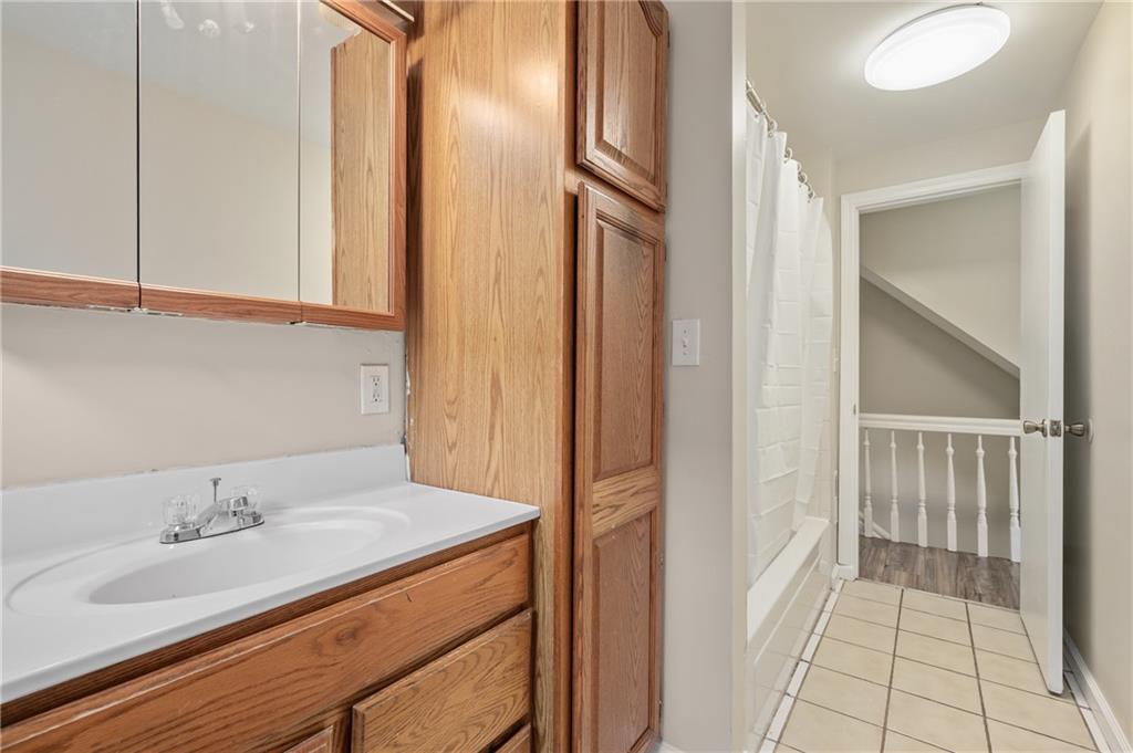 912 2nd Street McKees Rocks, PA 15136 - Photo 19 of 24 a bathroom with a sink and a mirror