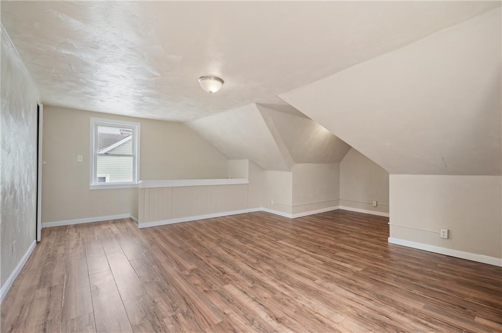 912 2nd Street McKees Rocks, PA 15136 - Photo 20 of 24 a view of empty room with wooden floor and fan