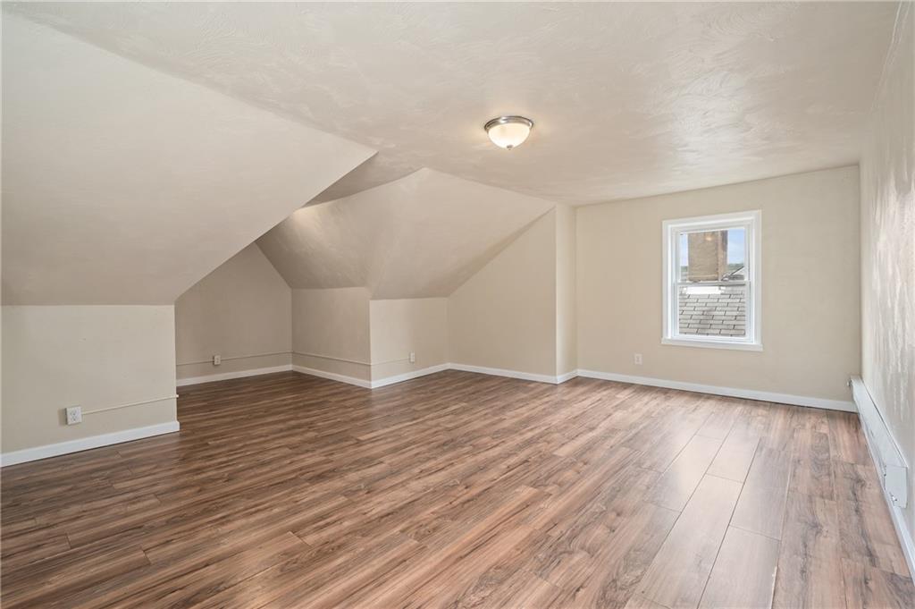 912 2nd Street McKees Rocks, PA 15136 - Photo 21 of 24 wooden floor in an empty room with a window