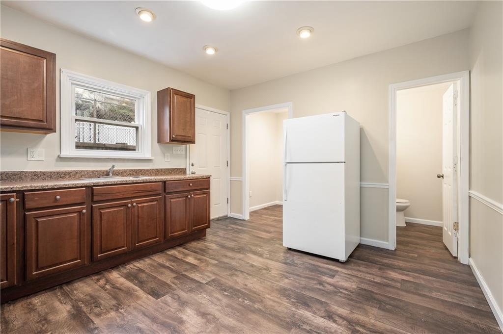912 2nd Street McKees Rocks, PA 15136 - Photo 10 of 24 a kitchen with a refrigerator and a sink