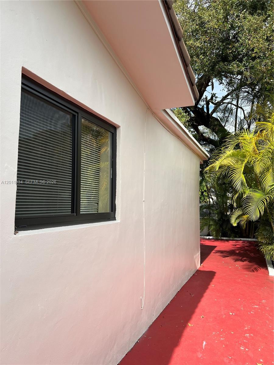 6385 Southwest 25th Street Miami, FL 33155 - Photo 24 of 28 a backyard of a house with lots of green space