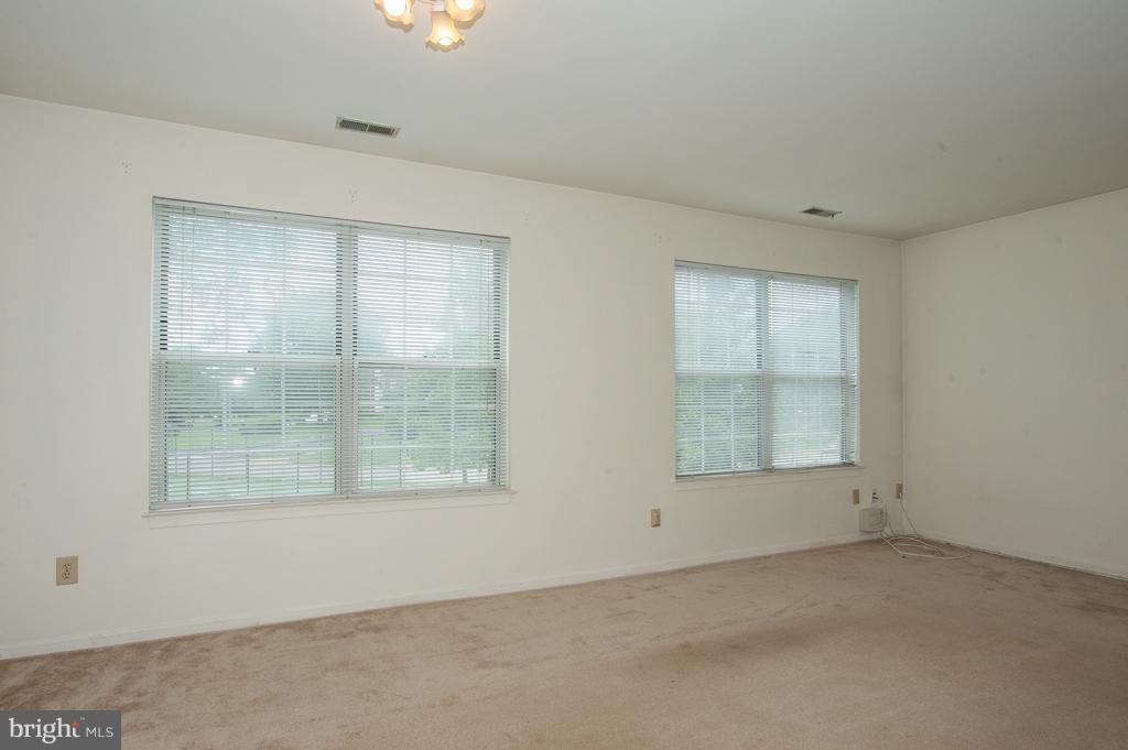 6601 China Grove Court Alexandria, VA 22310 - Photo 8 of 28 an empty room with a empty space and windows