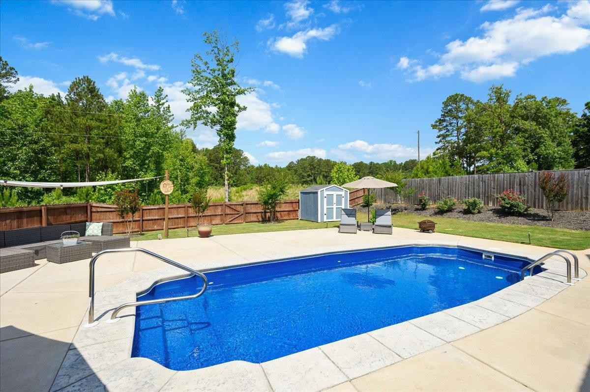 7032 Rex Road Holly Springs, NC 27540 - Photo 3 of 38 Amazing backyard with a beautiful salt water, heated, in ground pool for hot summer days or lazy nights. In ground heated salt water pool