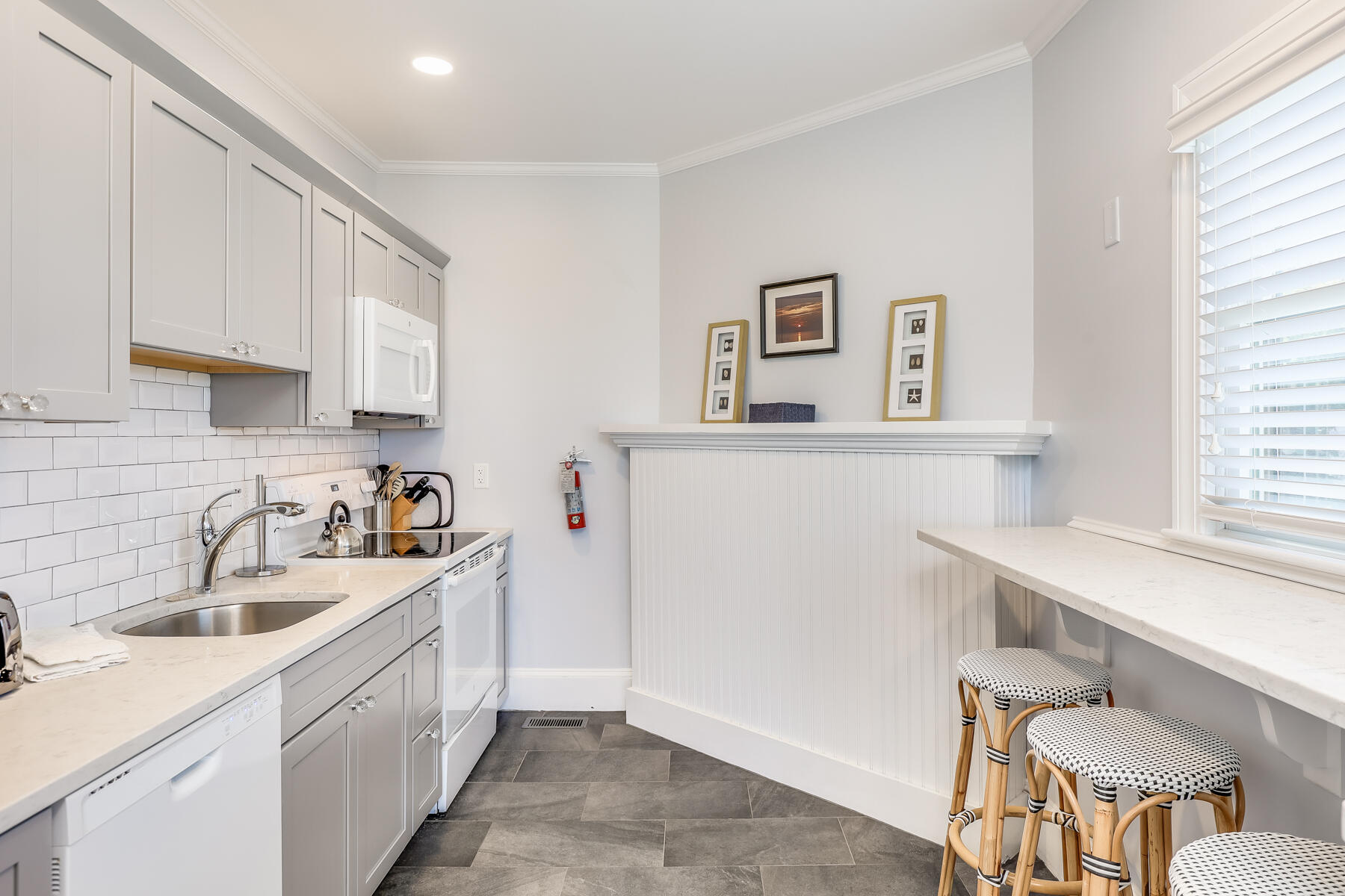 261 Linnell Landing Road, Unit 1 Brewster, MA 02631 - Photo 13 of 23 a kitchen with stainless steel appliances a sink and a refrigerator