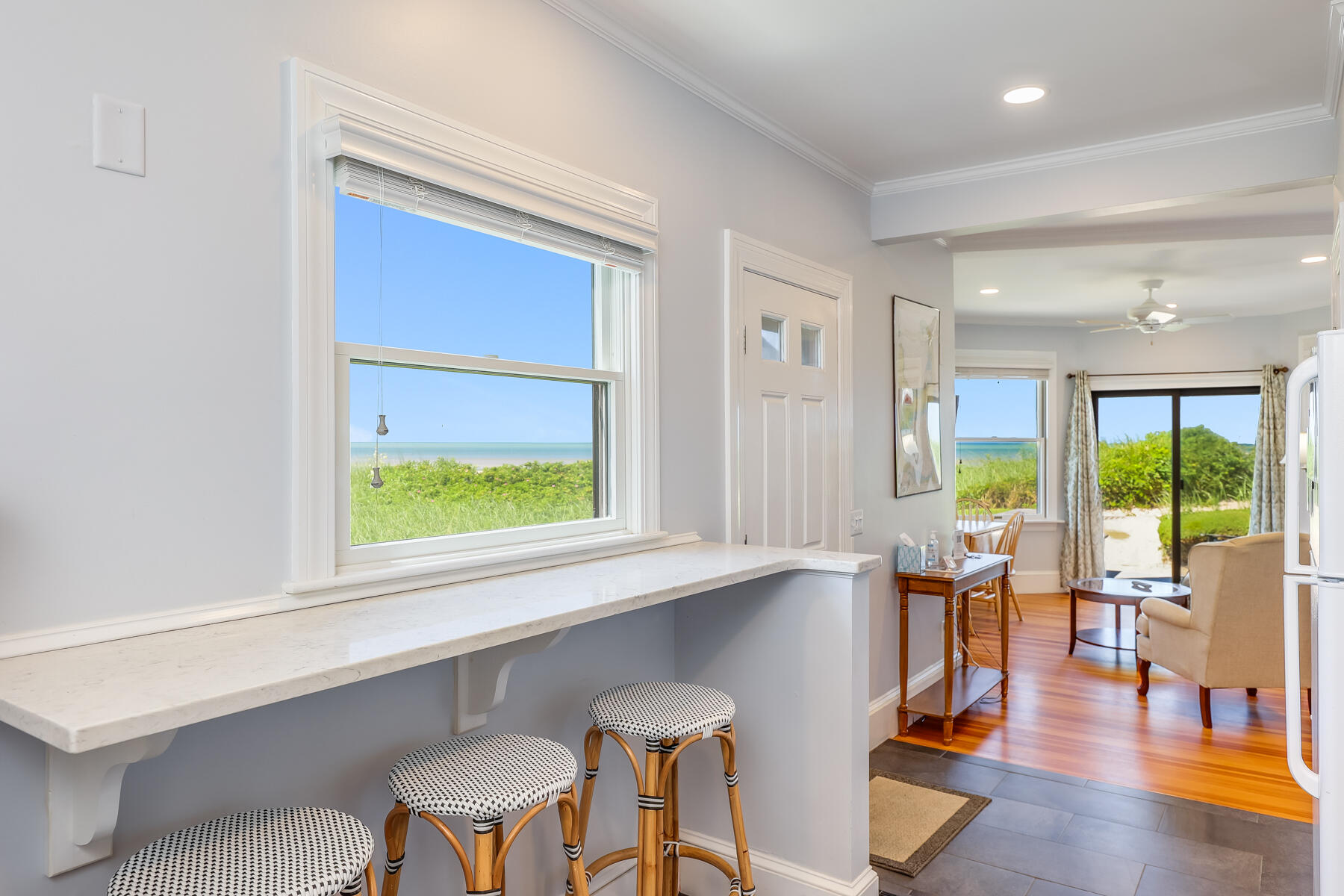 261 Linnell Landing Road, Unit 1 Brewster, MA 02631 - Photo 14 of 23 a view of a dining room with furniture window and wooden floor