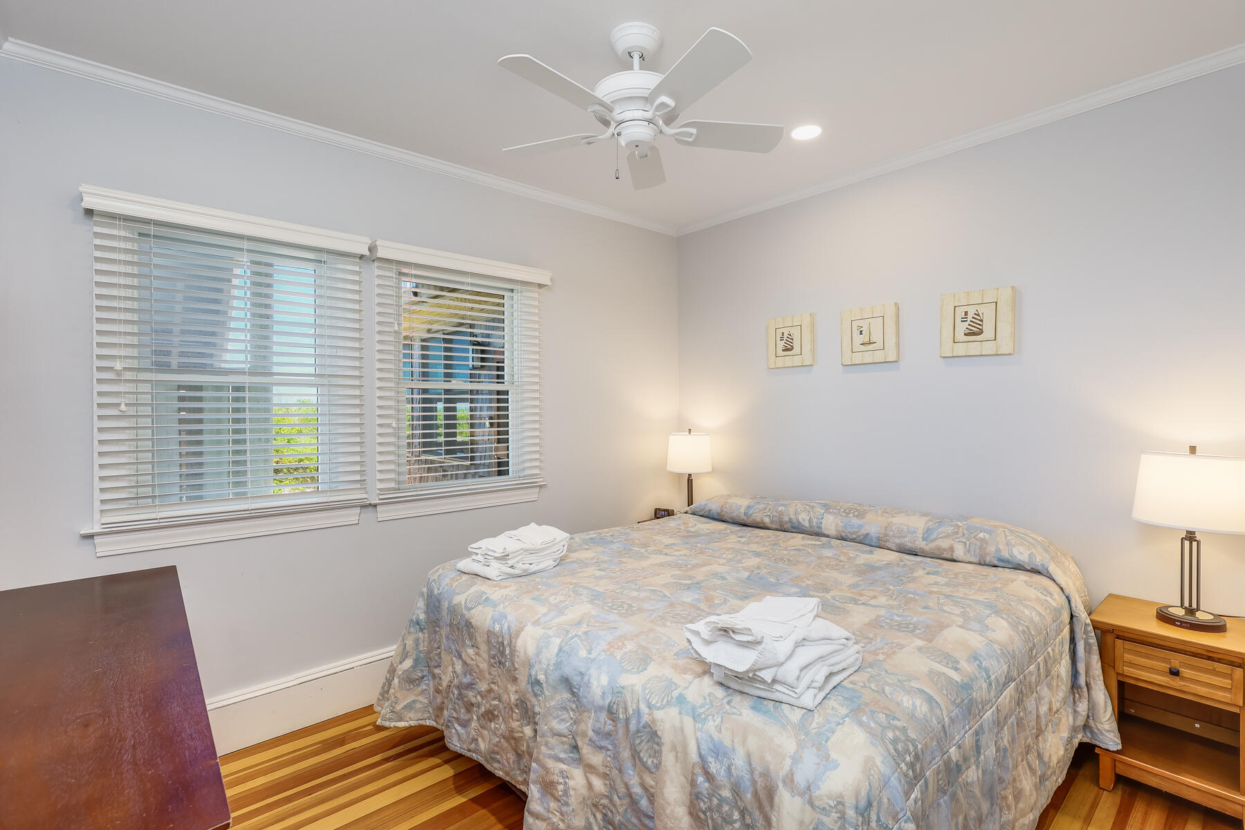 261 Linnell Landing Road, Unit 1 Brewster, MA 02631 - Photo 15 of 23 a bedroom with a bed and a lamp with window