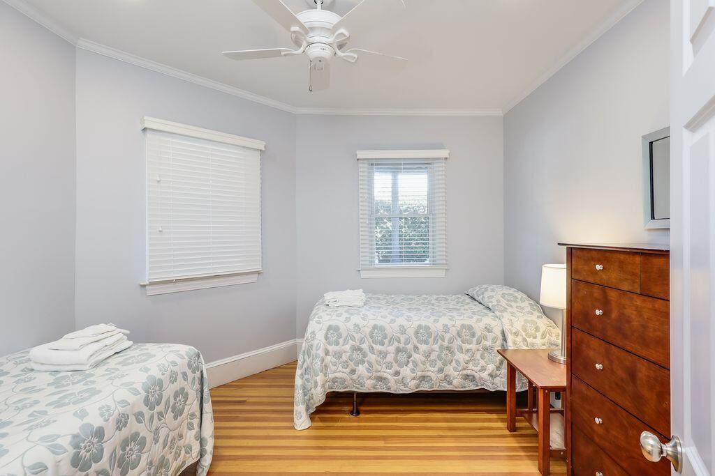 261 Linnell Landing Road, Unit 1 Brewster, MA 02631 - Photo 18 of 23 a bedroom with a bed and a window