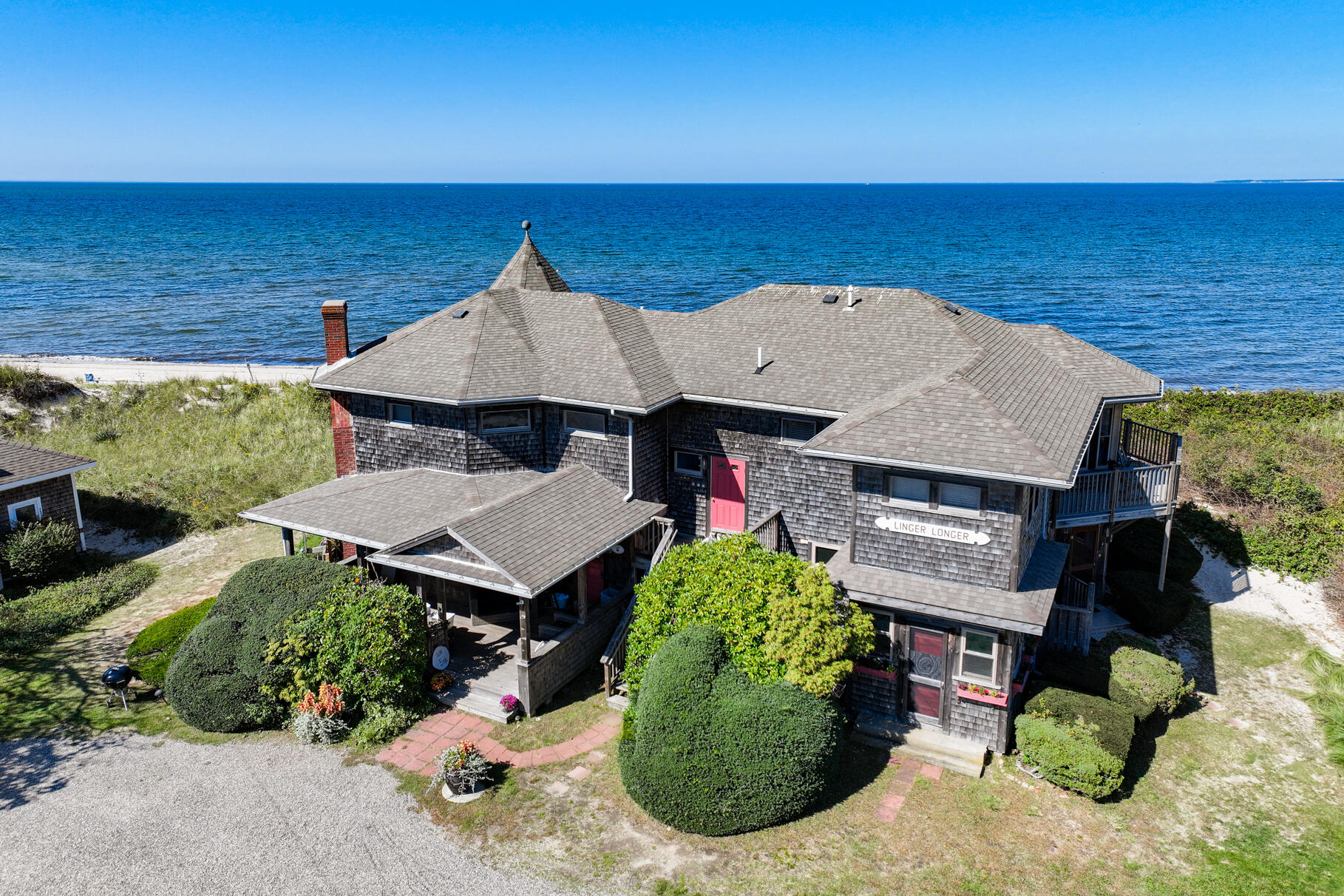 261 Linnell Landing Road, Unit 1 Brewster, MA 02631 - Photo 19 of 23 an aerial view of a house with a ocean view