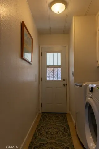 a view of a bathroom with washing machine