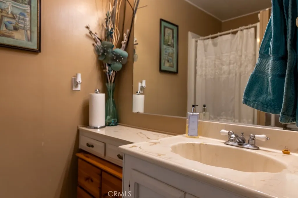 2601 Victoria, Unit 288 Compton, CA 90220 - Photo 18 of 25 a bathroom with a sink and a mirror