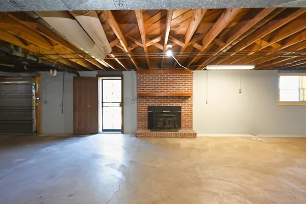 a view of an empty room with a fireplace