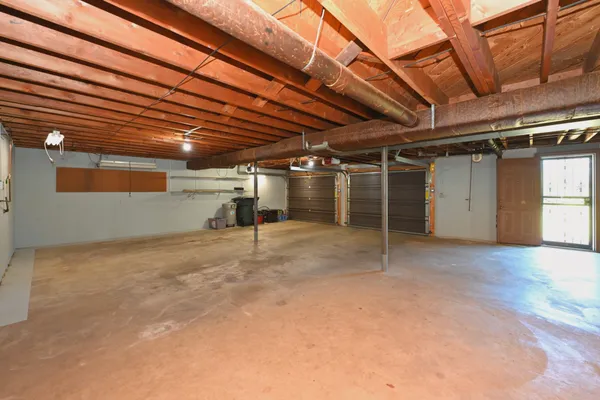 a view of an empty room with storage and utility