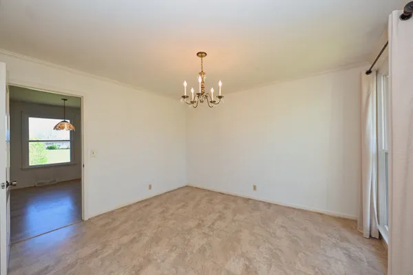 a kitchen with stainless steel appliances granite countertop wooden cabinets a sink and a window