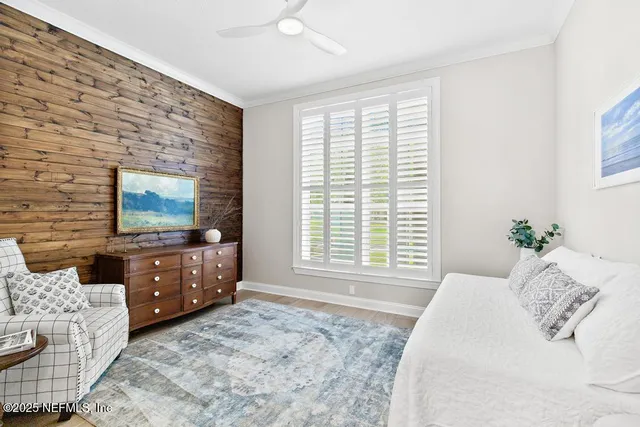 a bedroom with a bed and flat screen tv