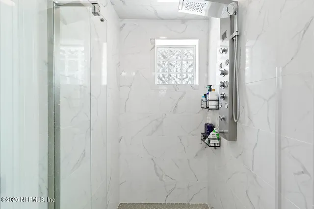 a bath room with a shower