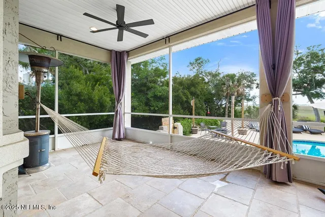 a view of a patio with a dining table and chairs