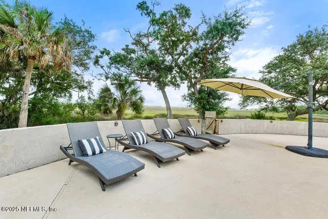 a roof view with sitting space and garden