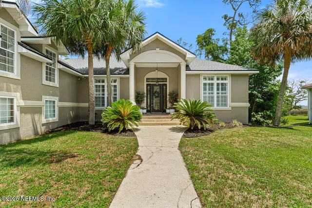 front view of a house with a garden