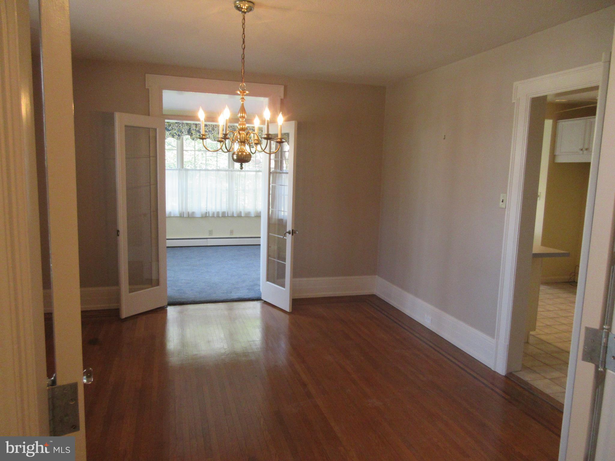 1100 Newlin Road York, PA 17403 - Photo 3 of 25 Glass French doors and inlaid hardwood floors acce