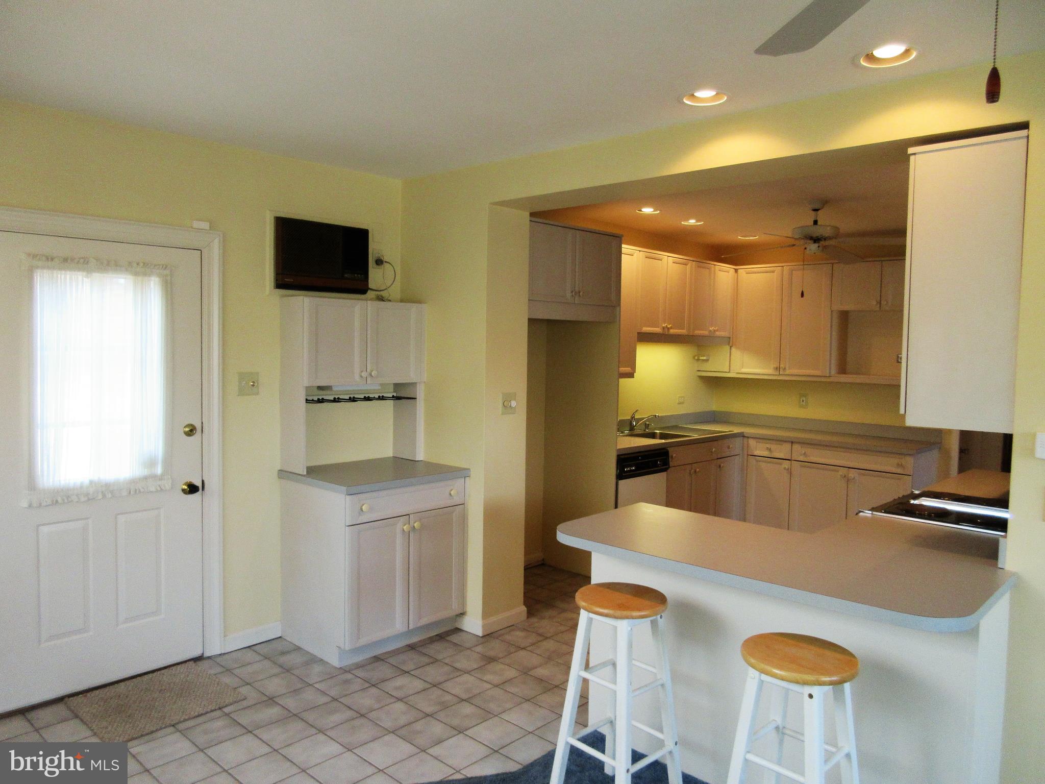 1100 Newlin Road York, PA 17403 - Photo 4 of 25 There's a modern kitchen with a breakfast bar.