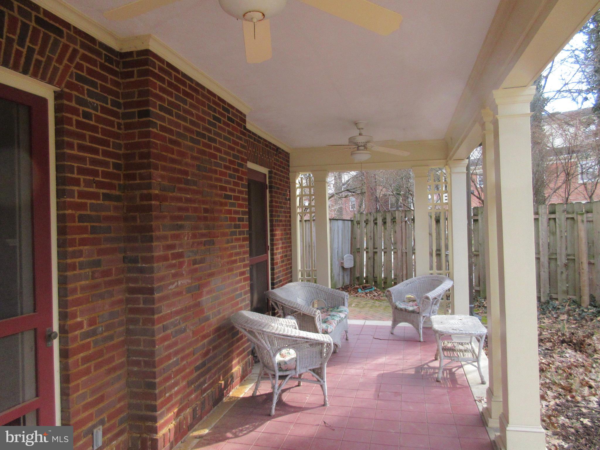 1100 Newlin Road York, PA 17403 - Photo 9 of 25 Relaxing covered porch overlooks the fenced garden