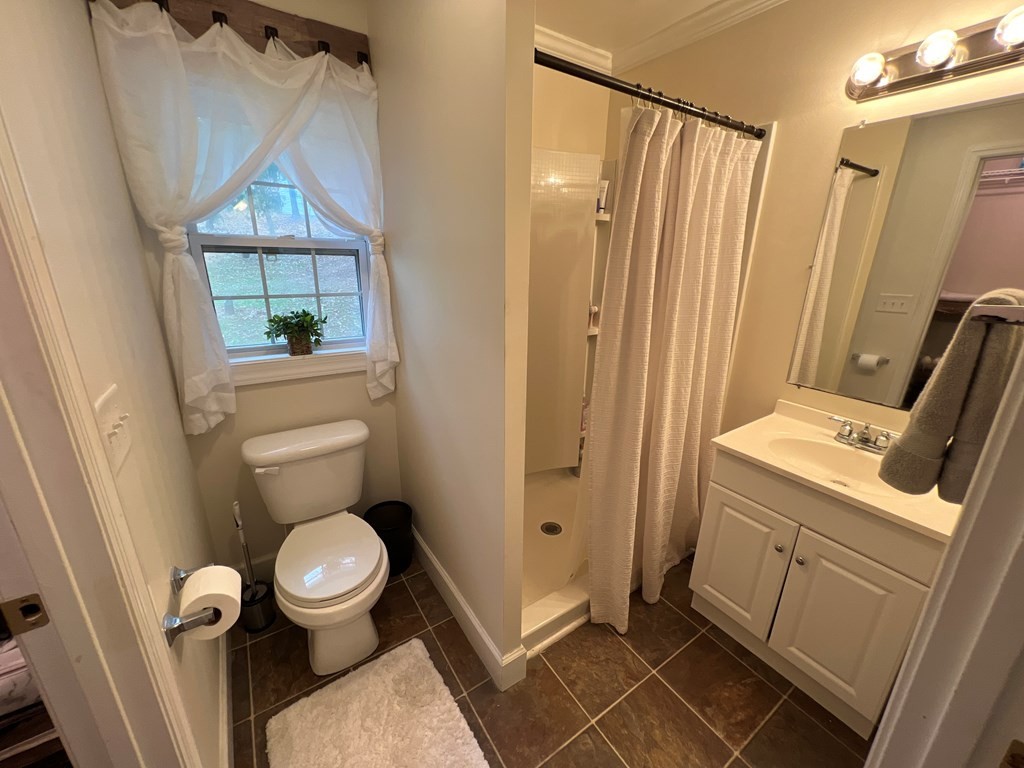 2050 Old River Road Charleston, TN 37310 - Photo 13 of 64 a bathroom with a toilet and a shower