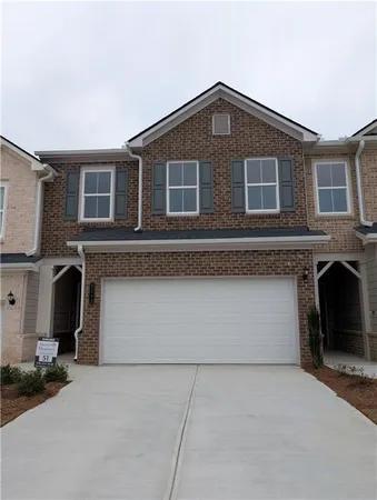 a front view of a house with a garage