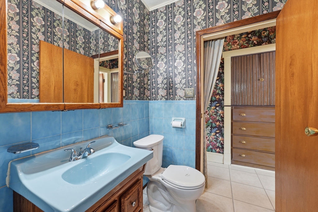 136 Maynard Street Springfield, MA 01109 - Photo 20 of 35 a bathroom with a sink a toilet and shower