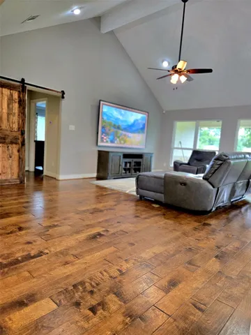 a view of a livingroom with furniture and a window