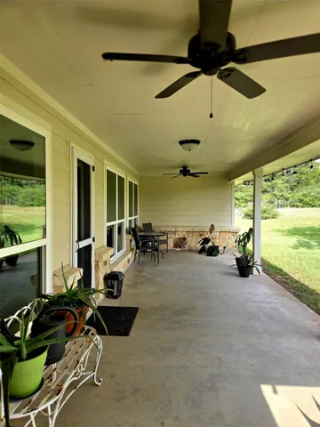 a bathroom with a granite countertop double vanity sink and mirror