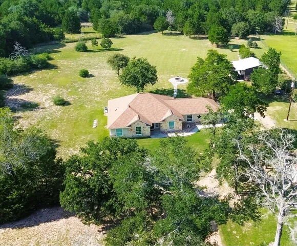 a view of a house with a big yard