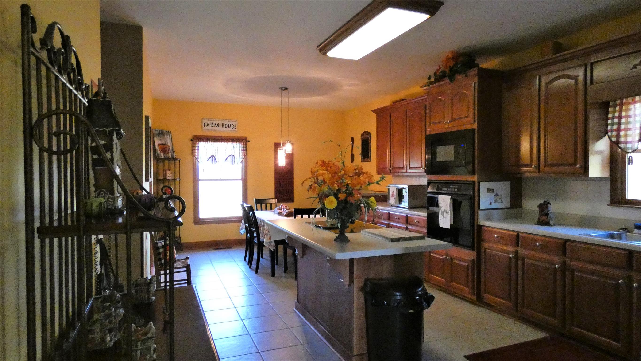 247 Poorhouse Road Taft, TN 38488 - Photo 10 of 32 a kitchen with a sink stove and cabinets