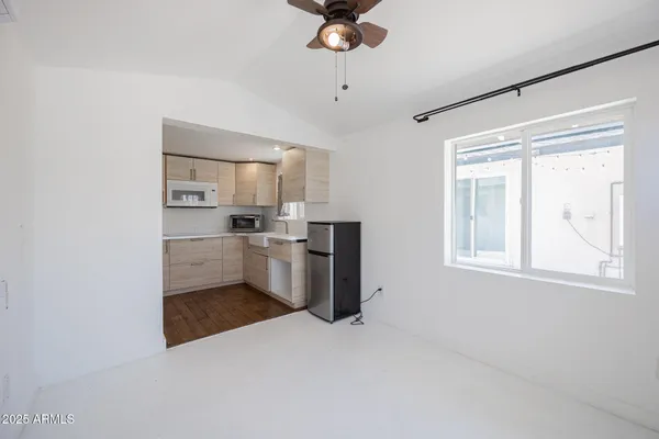 a view of a kitchen with a sink and cabinet