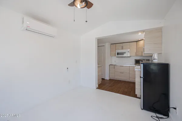 a kitchen with stainless steel appliances a refrigerator and a stove top oven