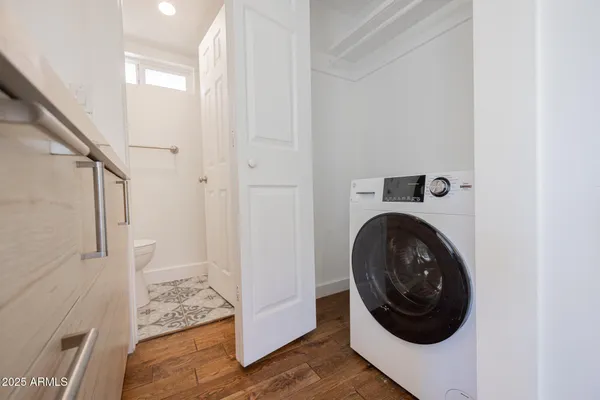 a view of a hallway with washer and dryer